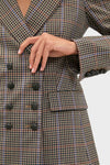 Close-up of the Russet Multi Claude Dickey Jacket, a classic double-breasted blazer with a small-check pattern and dark buttons, embodying effortless, high-end style.