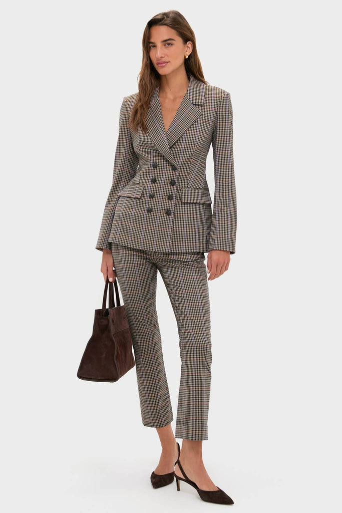 Woman modeling the Russet Multi Claude Dickey Jacket, a classic double-breasted plaid suit with a tailored fit, effortlessly styled with a dark brown suede tote and heels.