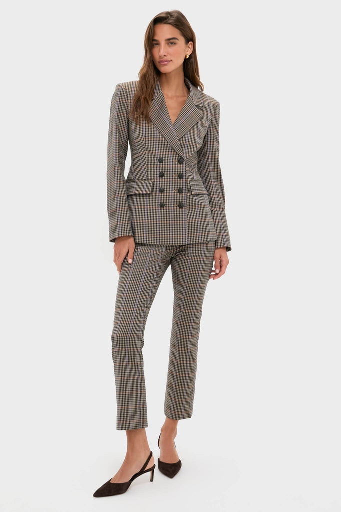 Model wearing the Russet Multi Claude Dickey Jacket, a classic double-breasted houndstooth suit with slim-leg trousers, exuding an effortless, high-end, and fun style.