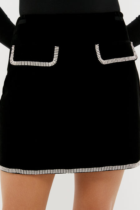 Black Velvet Rhinestone Loverly Mini Skirt with classic rhinestone-trimmed front flap pockets, creating an effortless, high-end look for fun events.