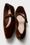 Loeffler Randall brown velvet flats with black trim, buckles, and an adjustable arch strap are shown on a white background.