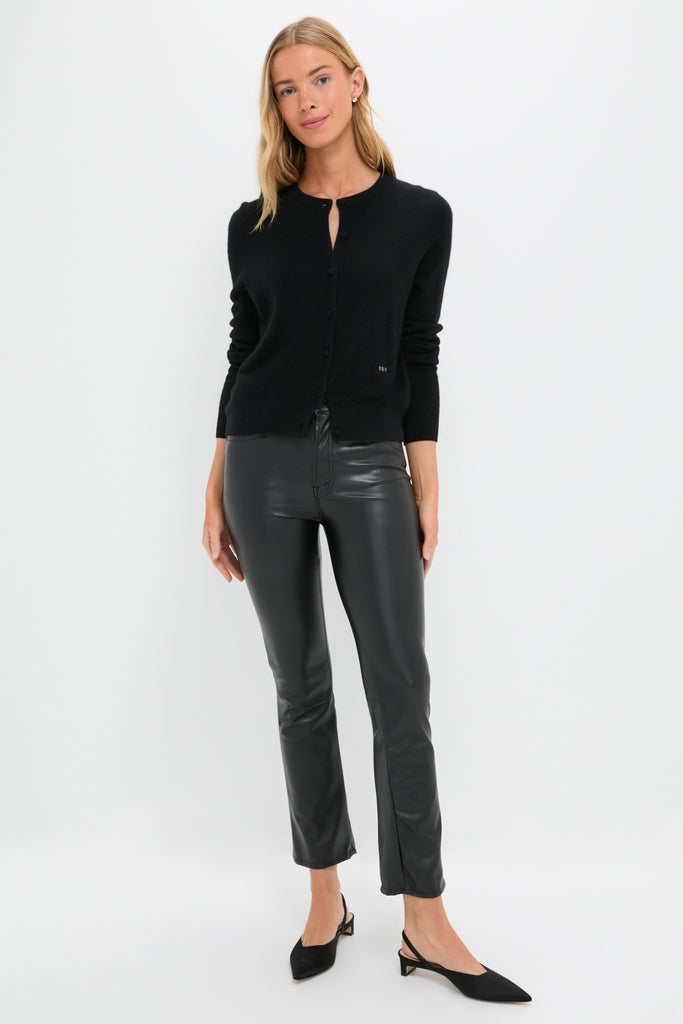 Model wearing Exclusive Black Faux Leather The Insider Flood pants, showcasing a classic, effortless style with a high rise and subtle flare for a fun, high-end look.
