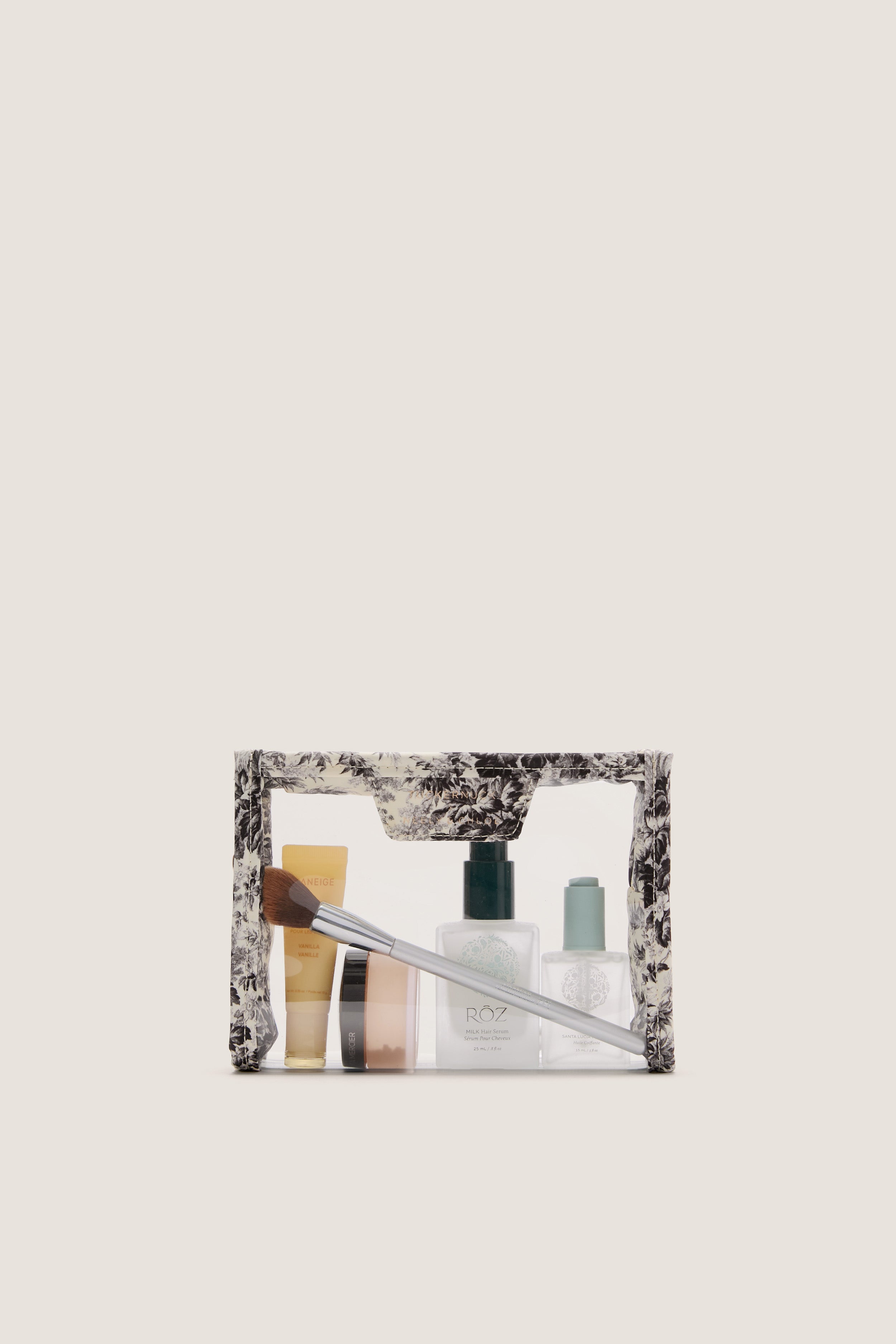Noir Cypress Toile PVC Wide Large Pouch, clear and classic, filled with an effortless selection of fun, high-end beauty essentials, perfect for stylish travel.