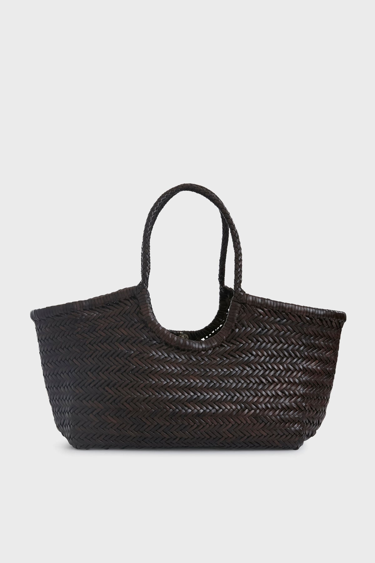 The Dragon Diffusion tote features a dark brown handwoven design with two handles and a bold herringbone pattern, making it perfect for stylish everyday use.