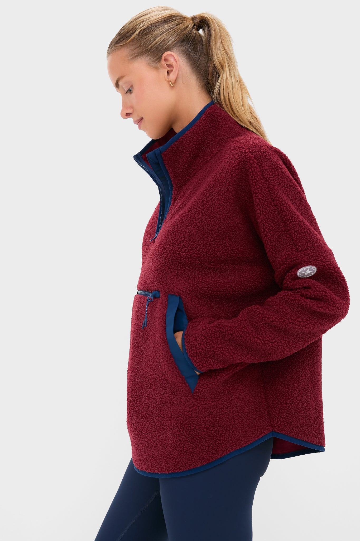 Cabernet Fleece Cady Quarter Zip: Classic sherpa-style pullover featuring effortless burgundy fleece, fun navy trim, and a cozy kangaroo pocket, perfect for a high-end casual look.