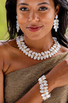 Woman models the classic Mermaid Garden Vine Bracelet, 7 - MOP, featuring elegant mother of pearl leaves and gold accents, creating an effortless, high-end, and fun bohemian look.