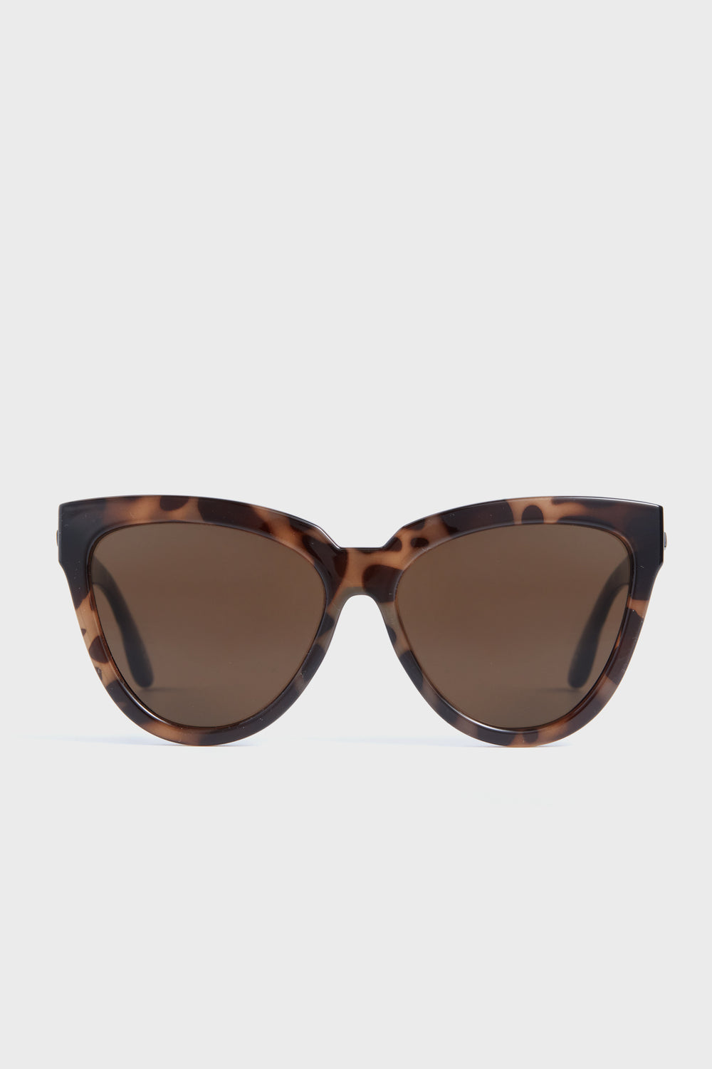Le Specs oversized cat eye sunglasses in brown tortoiseshell with dark tinted lenses and UV protection.