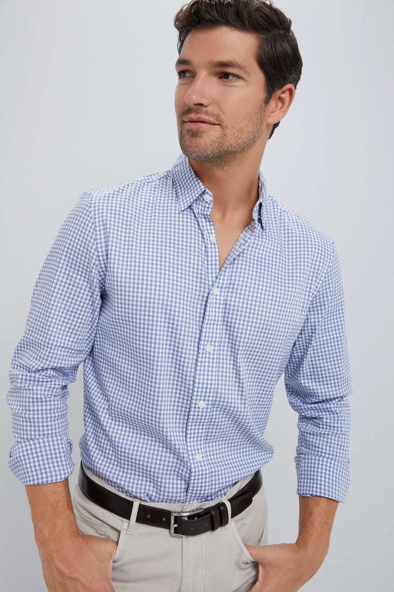 Model wearing the classic Light Blue Gingham Movement Shirt, effortlessly styled with rolled sleeves and beige chinos; a high-end, fun, and versatile choice for any adventure.