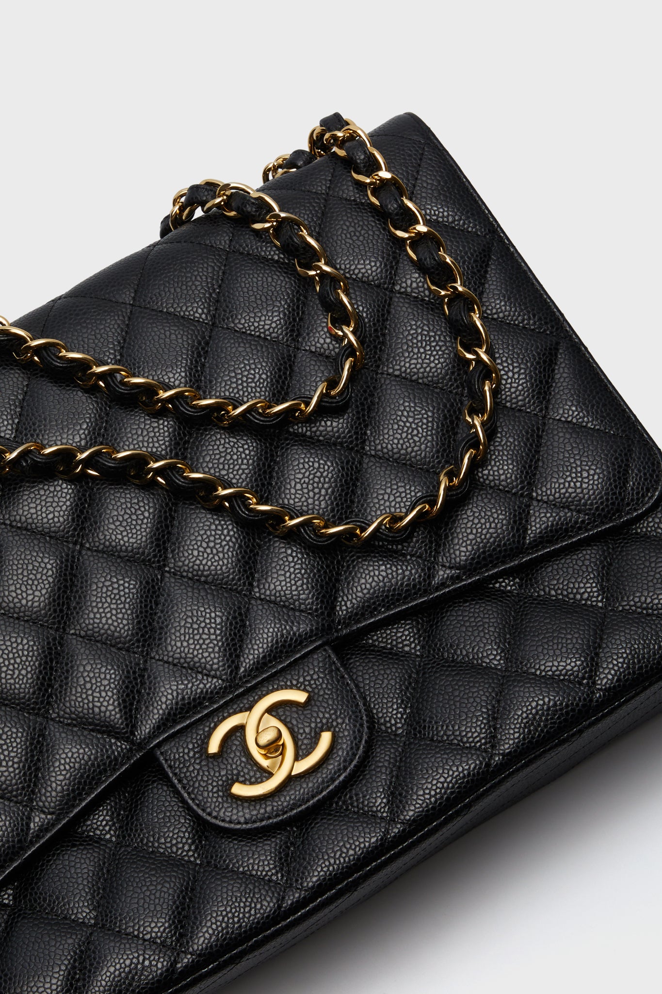 CHANEL Black Caviar Quilted Maxi Double Flap Shoulder Bag