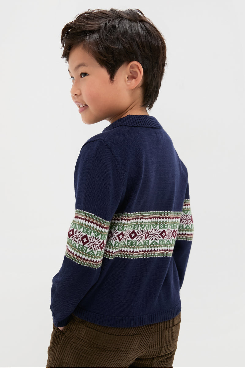 Young boy smiling in a classic, high-end Fairisle Collar Sweater, effortlessly styled with brown corduroy pants, capturing a fun and timeless look.