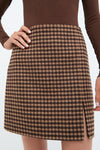 Noir and Noisette Mimi Mini Skirt: classic gingham design with side slit, offering an effortless, high-end look. Perfectly paired with fitted top for fun, confident style.