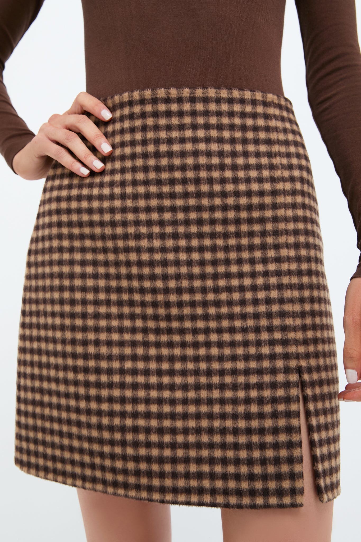 Noir and Noisette Mimi Mini Skirt: classic gingham design with side slit, offering an effortless, high-end look. Perfectly paired with fitted top for fun, confident style.