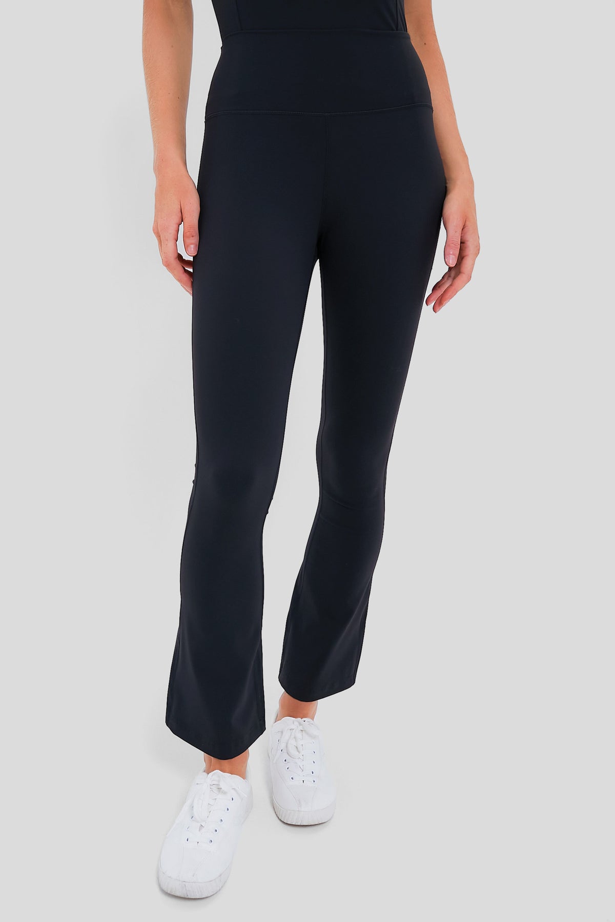 Classic Black High Rise Compression Spandex Millie Yoga Pant showcases an effortless, high-end style with a flared leg, perfect for fun, versatile wear.