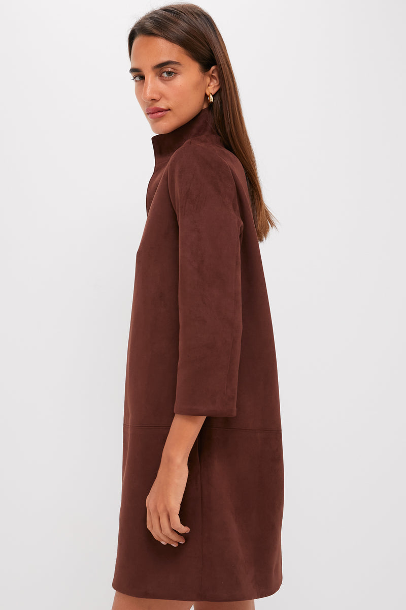 Young woman in profile wearing the Ganache Vegan Suede Clifton Dress, a classic, high-end shift with a stand collar and three-quarter sleeves, exuding effortless, fun sophistication.
