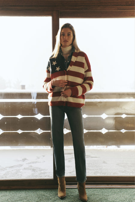 American Flag Lindsey Cardigan exudes classic, effortless style with its Americana knit and leather buttons, perfect for a fun, high-end winter look.