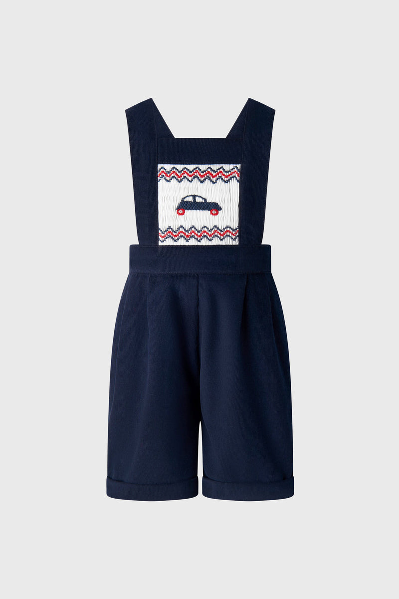 Rachel Riley navy blue toddler romper with wide straps, front panel featuring an embroidered car and red and white zigzag accents—a perfect pick for fans of Car Smocked Dungarees.