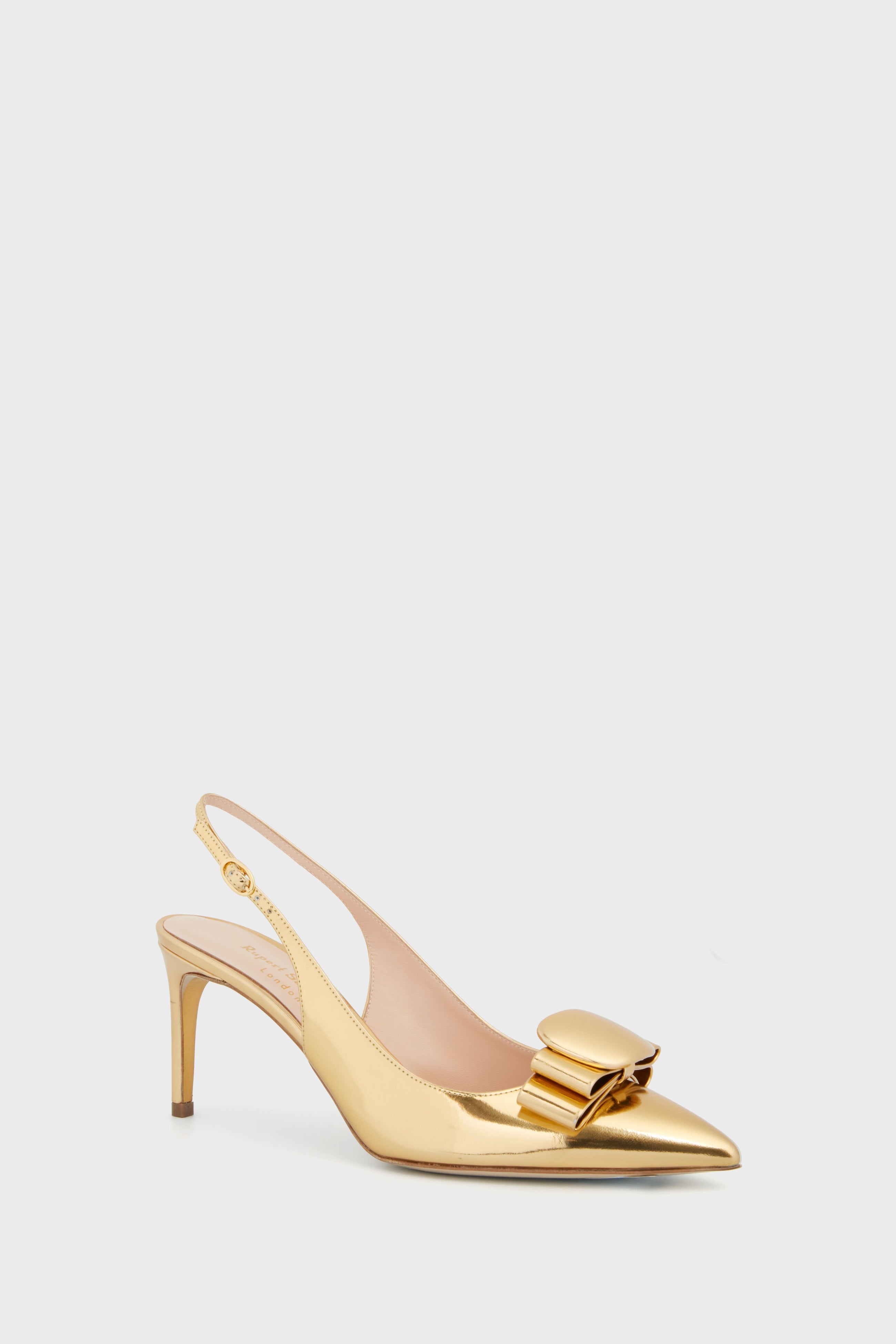 The Rupert Sanderson Gold Mirror Bramble Heels feature a pointed toe, stiletto heel, and a decorative bow on a gold slingback design for a chic, standout look.