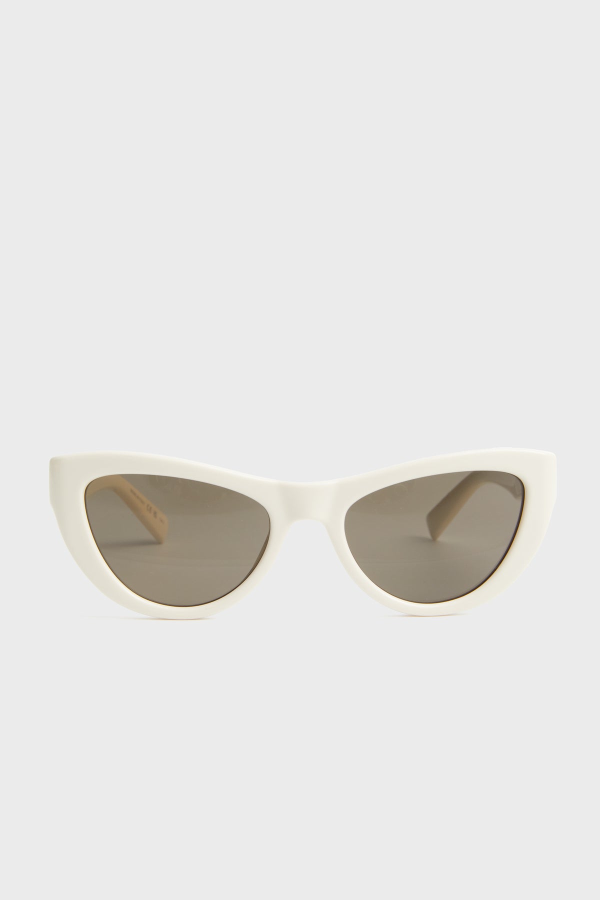 White cat-eye sunglasses by Saint Laurent feature dark lenses, front view, UV protection, and timeless style.