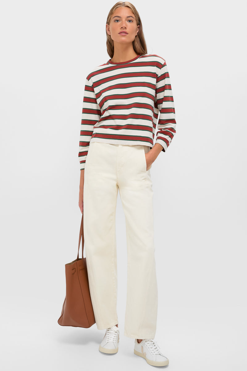 Model in Cream with Brown Campus Crew, embodying effortless style with classic stripes and relaxed fit, paired with high-waisted trousers and sneakers for a fun, high-end look.