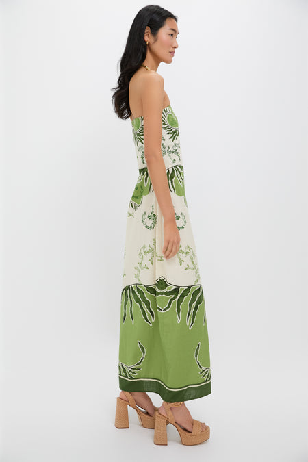 Ireland Green Wess Midi Dress: Strapless, elegant botanical print with a chic side slit. Perfect for effortless, high-end style, paired with tan sandals and gold jewelry.