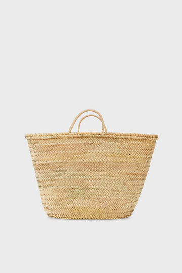 The Bella Cucina woven straw tote, featuring two small handles, makes a perfect market accessory.