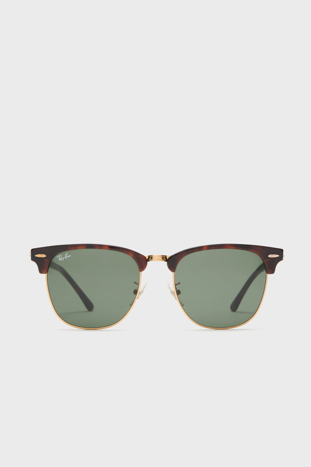 Front view of Ray-Ban Clubmaster tortoiseshell sunglasses with gold accents and green lenses, featuring the Ray-Ban logo on the upper left lens.