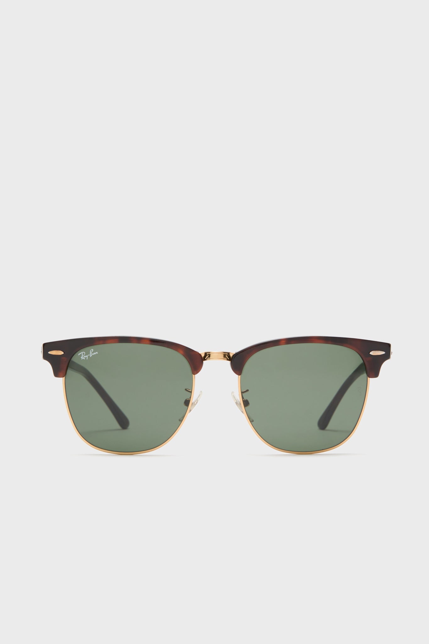 Front view of Ray-Ban Clubmaster tortoiseshell sunglasses with gold accents and green lenses, featuring the Ray-Ban logo on the upper left lens.