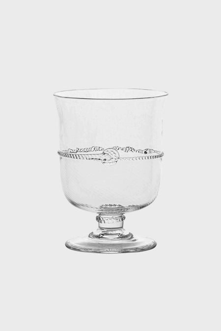 Juliska clear glass goblet features a wide bowl, short stem, and decorative horizontal swirl pattern. Inspired by classic Bohemian design, it can also be used as an elegant hurricane candle holder.