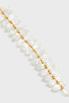 Mermaid Garden Vine Bracelet: Classic and effortless, this hand-carved mother-of-pearl bracelet features luminescent leaf motifs, textured gold beads, and intricate details for a fun, high-end statement.