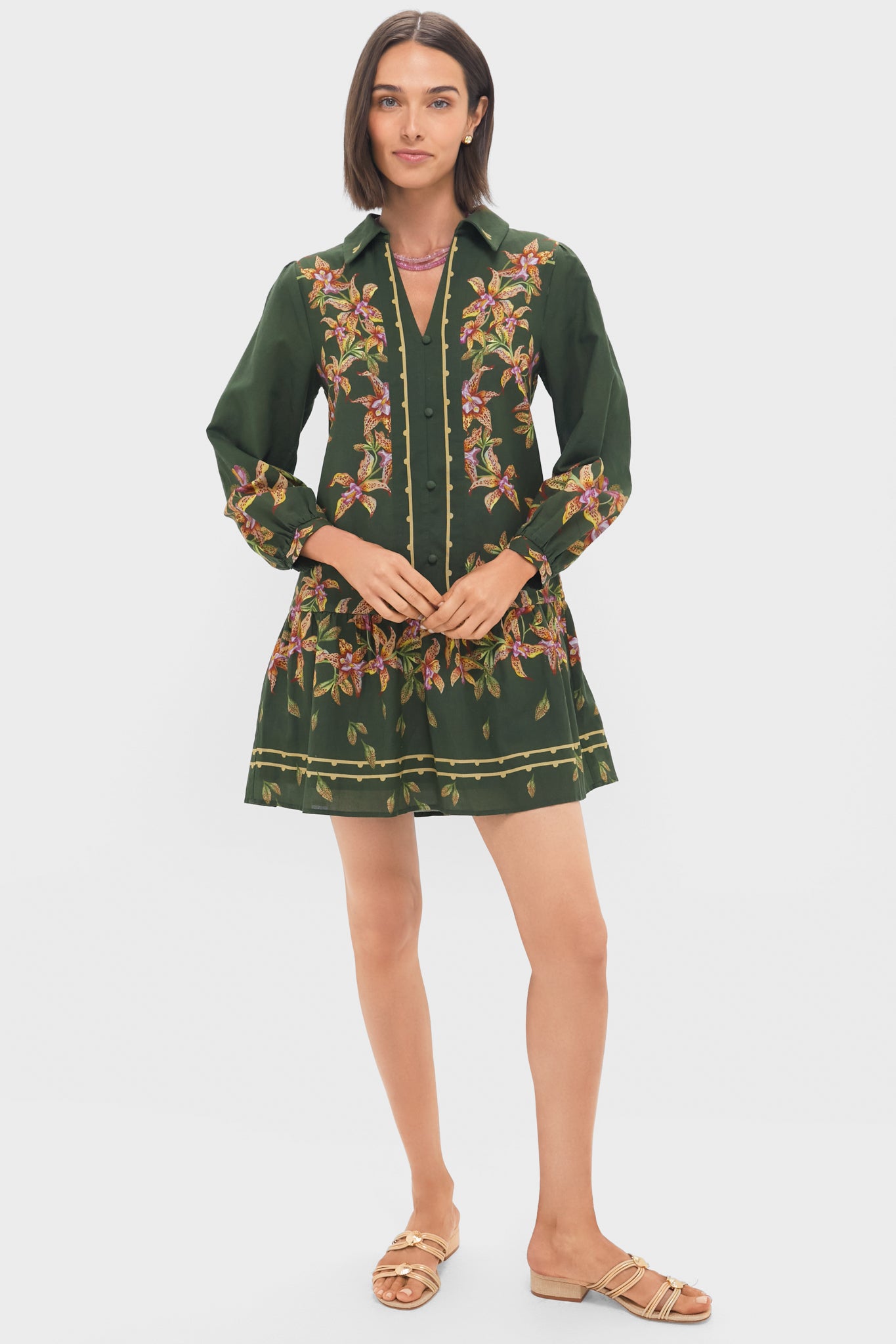 Hunter Lilly Porter Mini Dress features a classic V-neckline and colorful botanical motif, effortlessly blending fun and high-end style for any occasion.