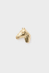 A small gold horse head figurine by Cesoli is displayed, its design reminiscent of a horse motif buckle.