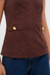 Brown Faux Suede Franz Top with high neckline, faux pockets with gold buttons, paired with blue denim jeans, embodies effortless, classic, high-end style for fall.