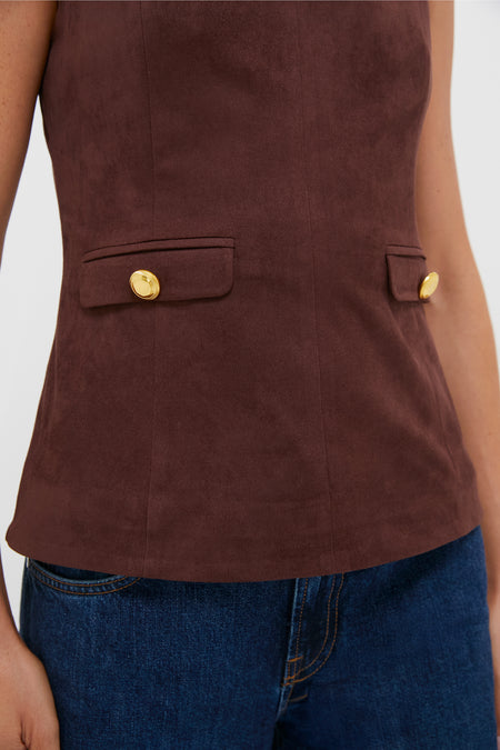 Brown Faux Suede Franz Top with high neckline, faux pockets with gold buttons, paired with blue denim jeans, embodies effortless, classic, high-end style for fall.