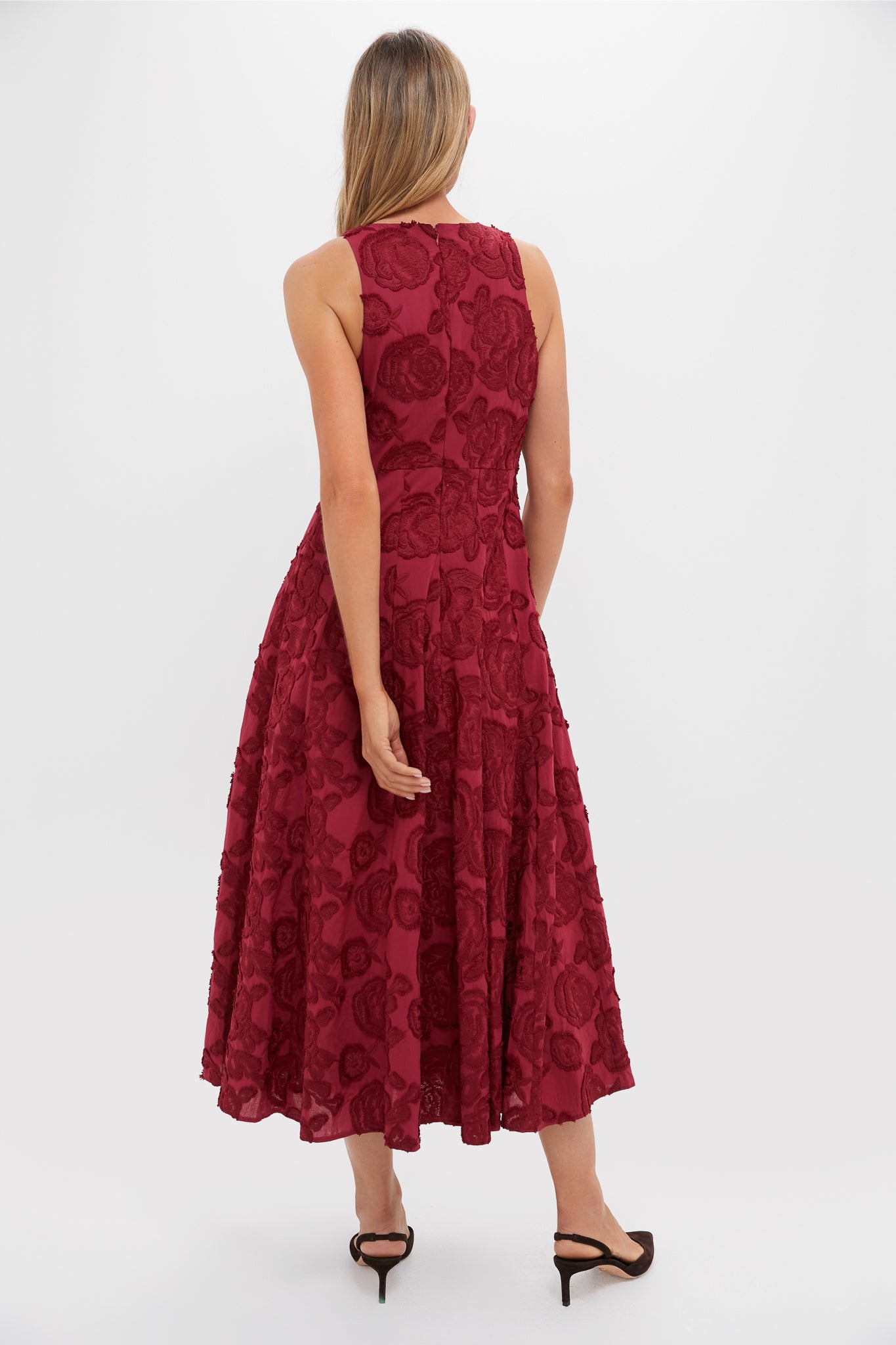 Ruby Textured Floral Melina Maxi Dress: A classic, effortless burgundy dress with embroidered rosette texture, fitted bodice, and flared skirt. Perfect for high-end, fun occasions.