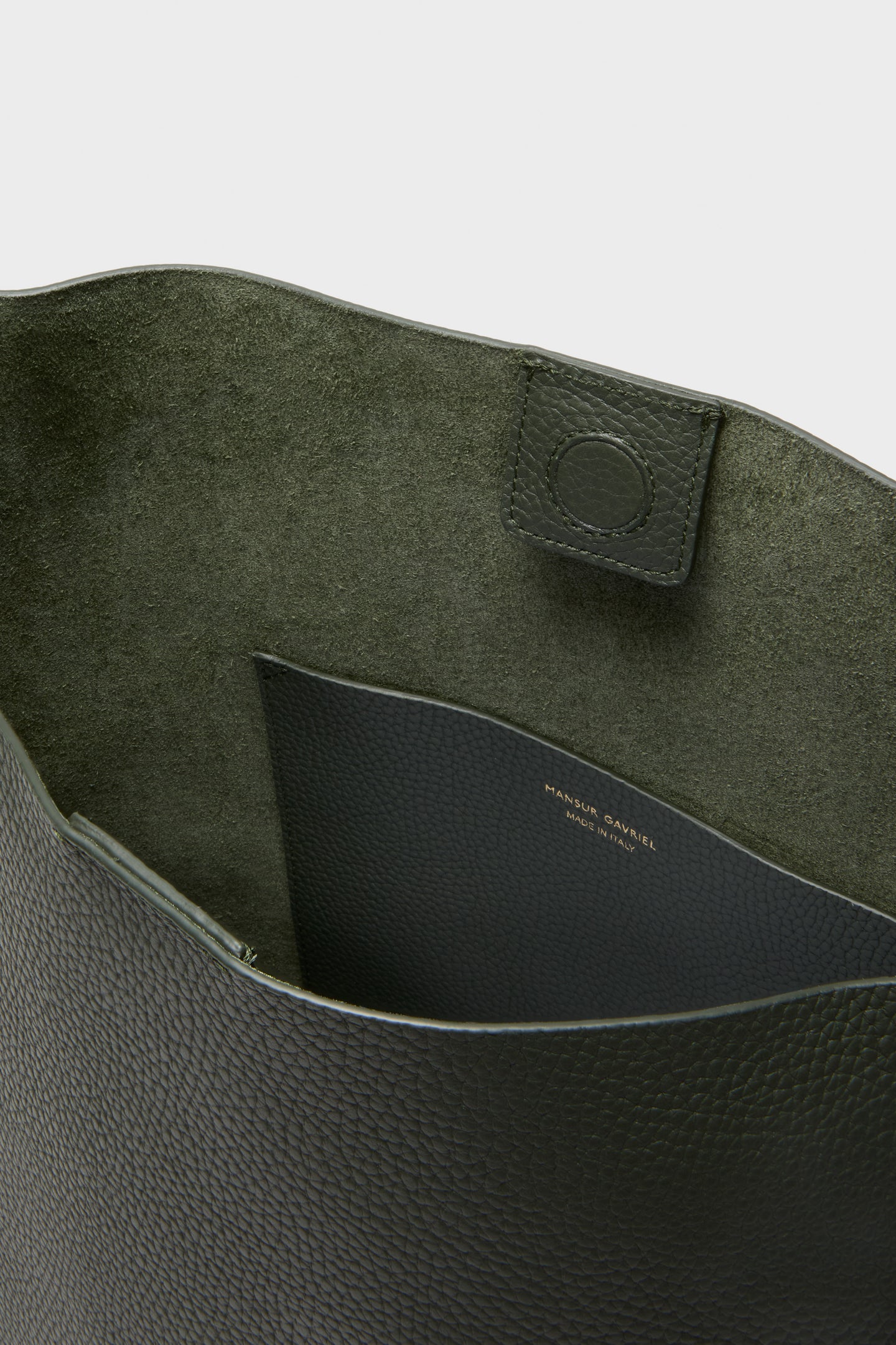 Interior view of the Seaweed Everyday Cabas, showcasing its classic suede-lined interior, effortless slip pocket, and high-end magnetic closure, reflecting Tuckernuck's fun, luxurious style.