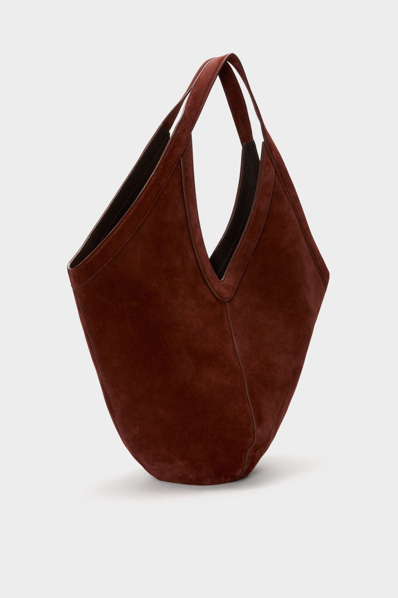 Classic Chocolate Soft M Hobo handbag in deep brown suede, featuring a slouchy design with V-shaped opening and medium straps, exuding effortless, high-end style.