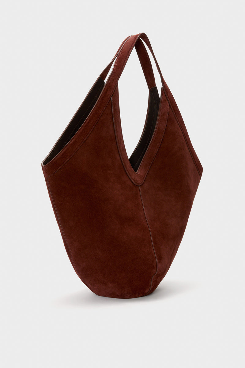 Classic Chocolate Soft M Hobo handbag in deep brown suede, featuring a slouchy design with V-shaped opening and medium straps, exuding effortless, high-end style.