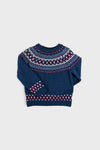 A Pepa London children's blue wool sweater with a red, white, and blue geometric Fair Isle pattern on the chest, shoulders, cuffs, and hem is laid flat on a white background.