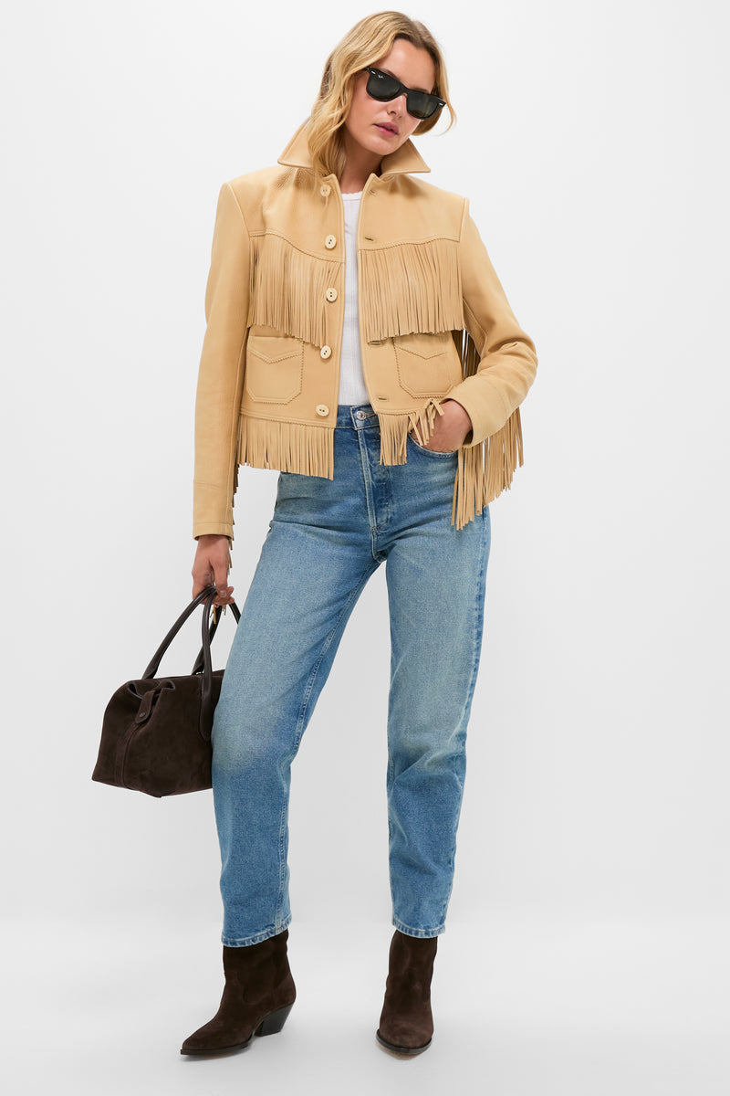 Model in a classic Tan Deerskin Fringe Jacket paired with denim, embodying an effortless, fun Western-inspired style.