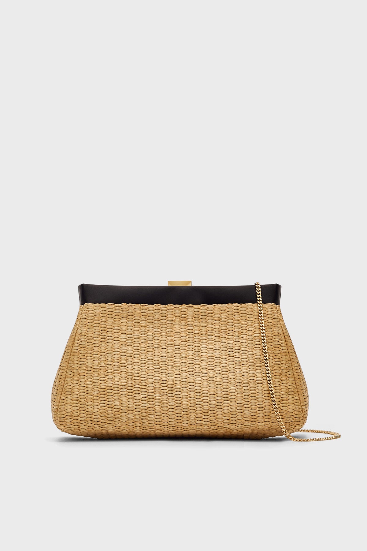 The Demellier Natural Raffia Clutch features a woven tan design, black top frame, gold clasp, and thin gold chain strap—a handcrafted handbag thats perfect as an elegant evening bag.
