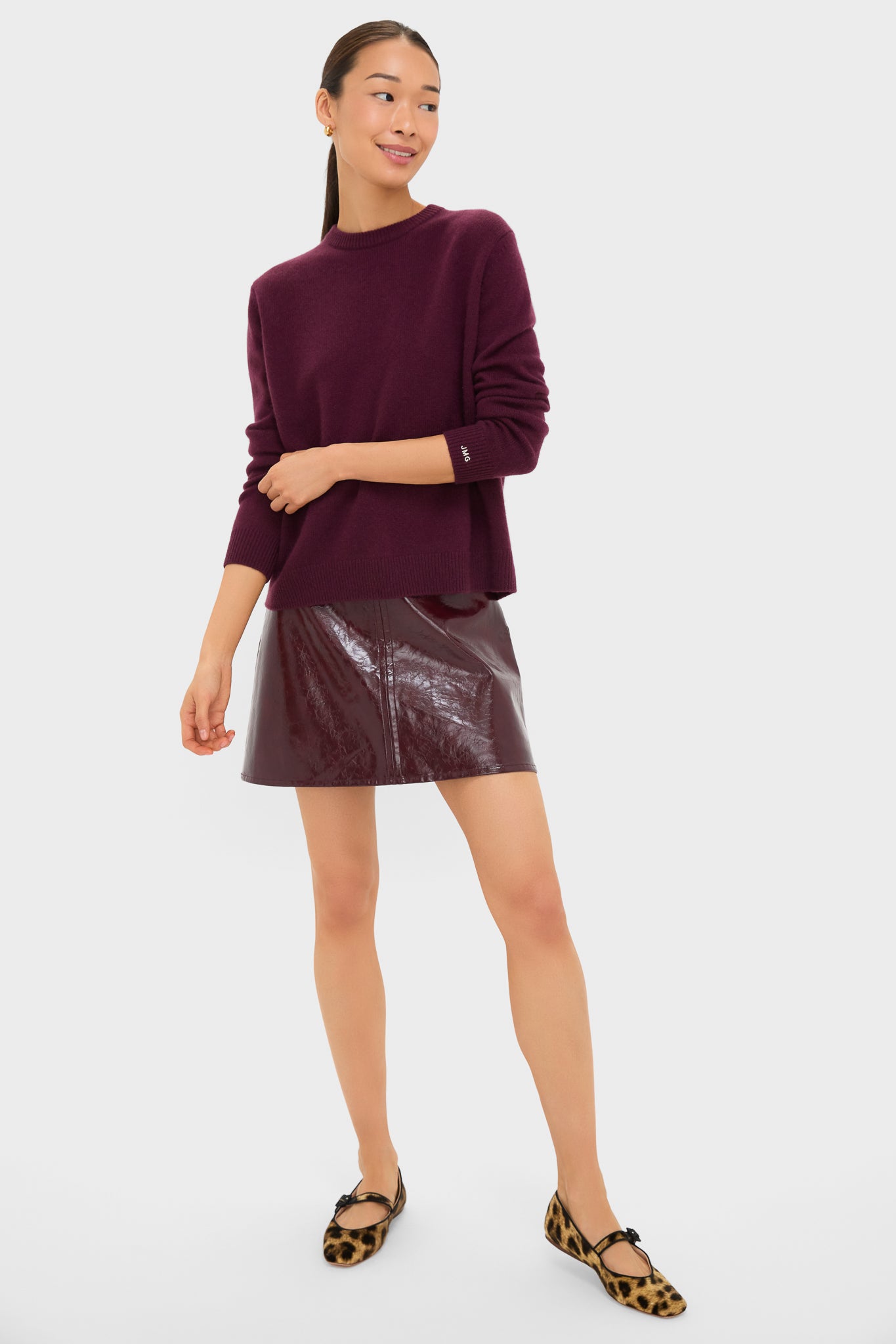 Young woman models the classic Winetasting Cashmere Bodie Boyfriend Crewneck, showcasing its effortless, high-end design with a relaxed fit and ribbed hem.