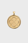 Jane Win gold oval pendant featuring an engraved quatrefoil design with a small heart at the center and decorative flourishes, crafted in a 14k gold plated finish.