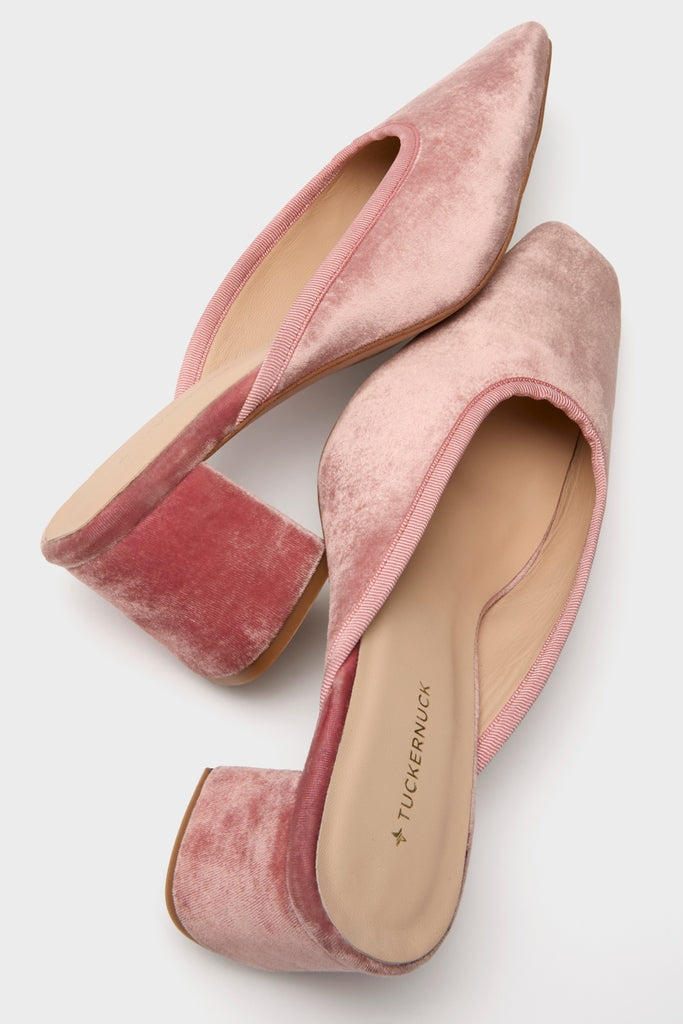 Blush Velvet Tilda Mules feature classic slip-on design, effortless pointed toes, fun ribbon trim, and high-end low block heels in soft pink velvet.