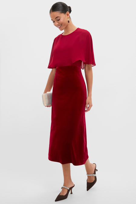 Model showcases the classic Chocolate Satin Mae Heels, featuring an effortless mule silhouette, chic satin pointed toe, and fun crystal arch strap, perfect for high-end occasions.