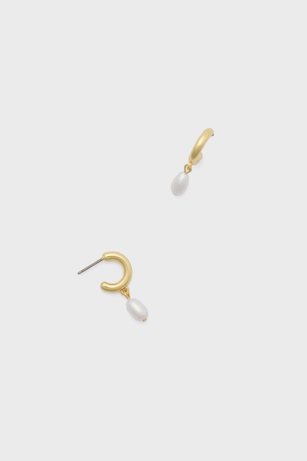 A pair of gold earrings, each features a small pearl drop.