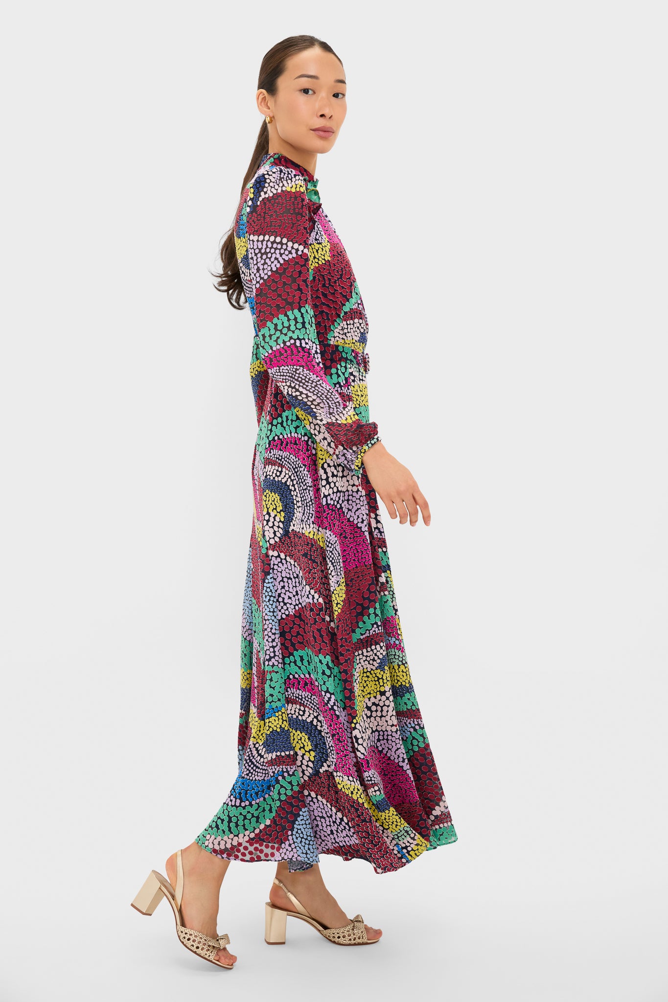 Model in classic Jangle Jacqui-B Dress with vibrant print, showcasing effortless elegance and fun style, featuring a high neckline and flowing skirt.