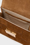 Woven Cacao Suede Delphine Crossbody Bag, showcasing a classic, high-end design with woven suede panels and gold-tone clasp, open to reveal an effortless, fun interior.