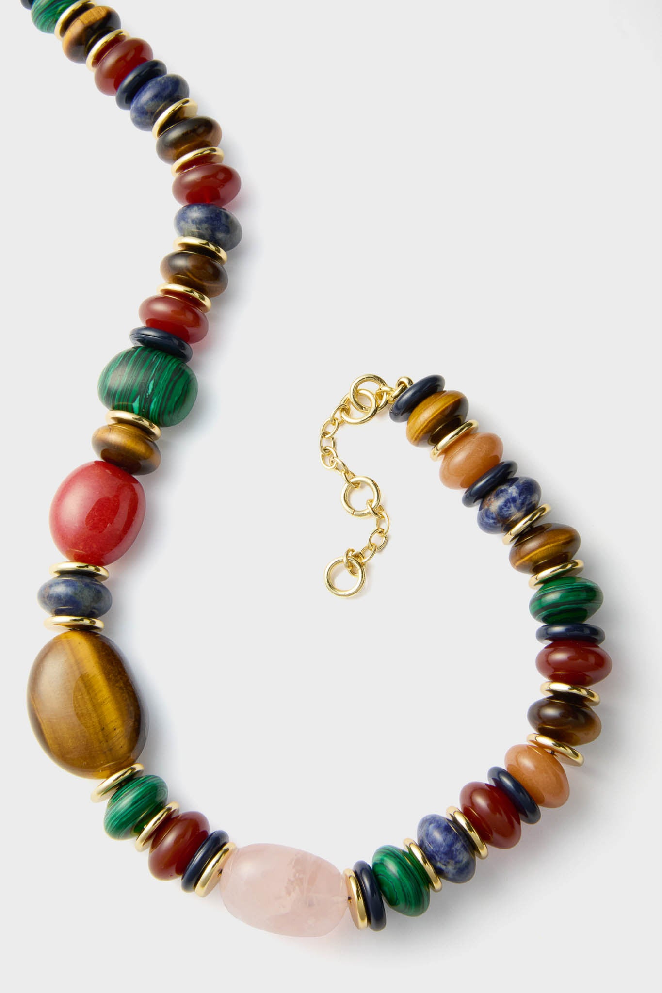 Mixed Stone Francis Necklace: A classic, high-end piece with vibrant semi-precious stones and gold-tone rings, offering an effortless, fun style with adjustable length.