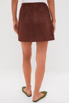 Ganache Vegan Suede Meg Mini Skirt: A classic A-line mini, effortlessly styled with pointed-toe flats, exudes fun and high-end appeal, perfect for transitional wardrobe updates.