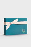 Merry Gift Tags: Classic, high-end gift box with embossed initials, wrapped in teal with a pink ribbon. Effortless elegance for a fun, festive touch.